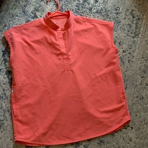 Gently used. This style scrub top is an oversized look.